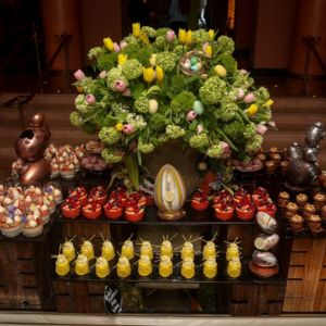 Food table with sweets and Easter decorations