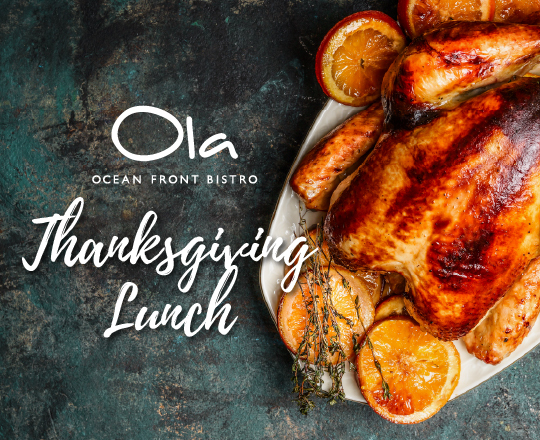 Turkey dinner plate on a table which reads Ola A Day of Thanks
