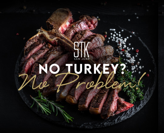 stk table with steak plate, sauces, and sliders.