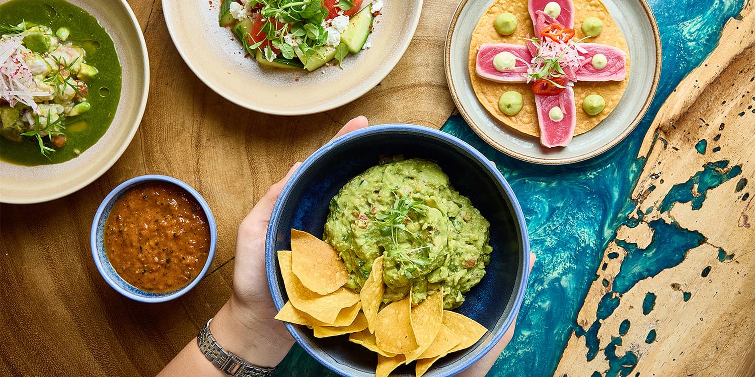 Fresh green dish topped with decorative purple leaves | Condado Vanderbilt Hotel