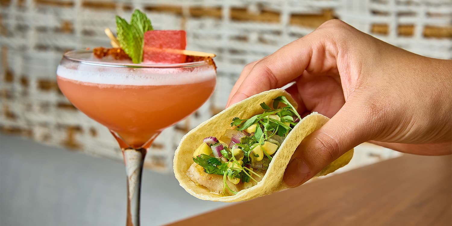 Plated cut of beef served over a bed of corn | Condado Vanderbilt Hotel