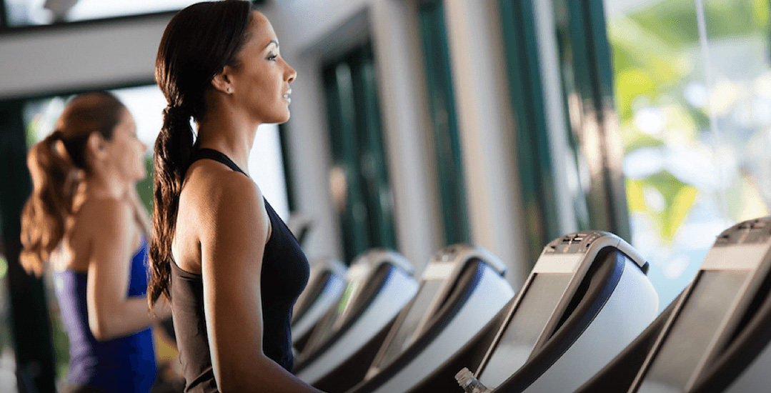 Bright gym with treadmills lined up | Condado Vanderbilt Hotel
