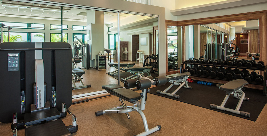 A modern gym interior featuring exercise equipment | Condado Vanderbilt Hotel