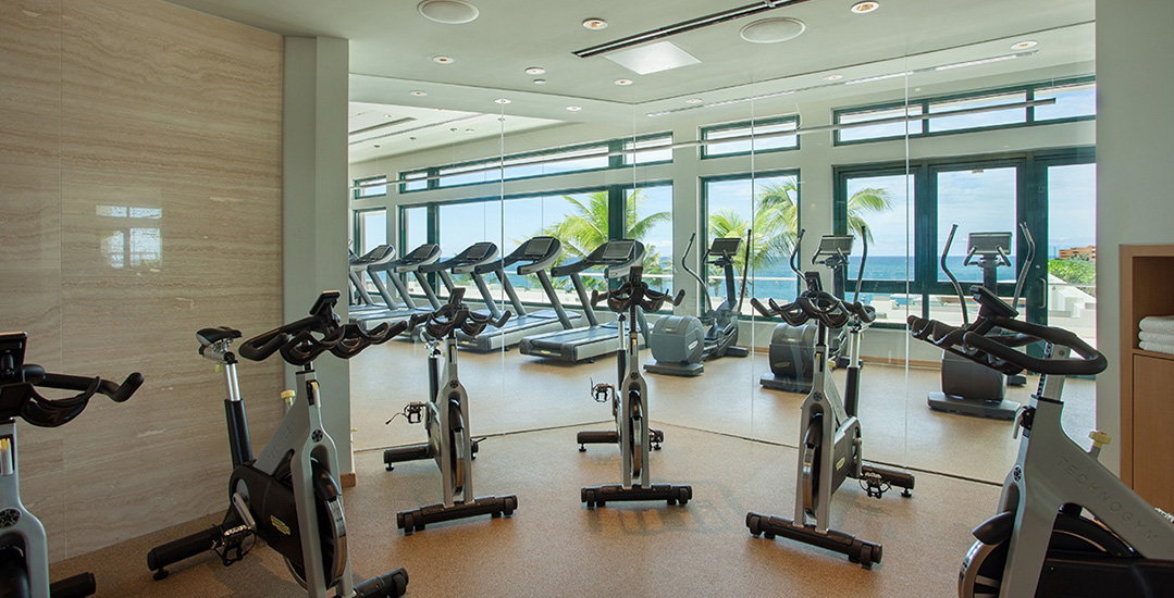 Gym with exercise bikes and treadmills | Condado Vanderbilt Hotel