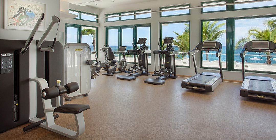 Gym with exercise equipment and panoramic ocean views | Condado Vanderbilt Hotel