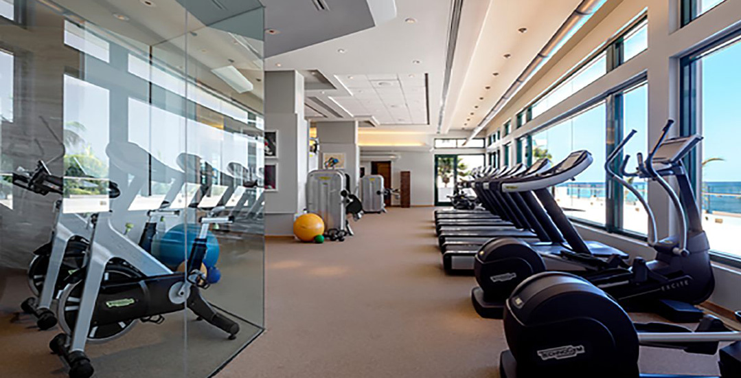 A gym featuring treadmills and stationary bikes | Condado Vanderbilt Hotel